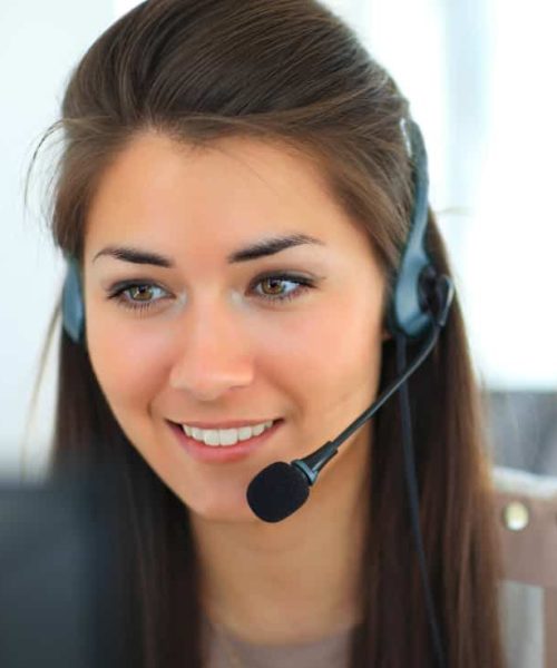 Female customer support operator with headset and smiling