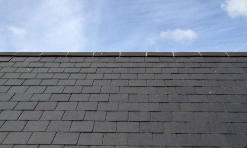 Slate roof against blue sky on the island of Jersey